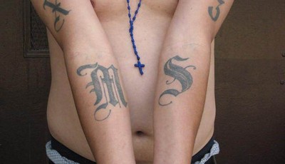 
              This handout photo provided by US Immigration and Customs Enforcement, taken June 23, 2008 in Washington, shows an example of a tattoo of the gang Mara Salvatrucha (MS-13). The Obama ad